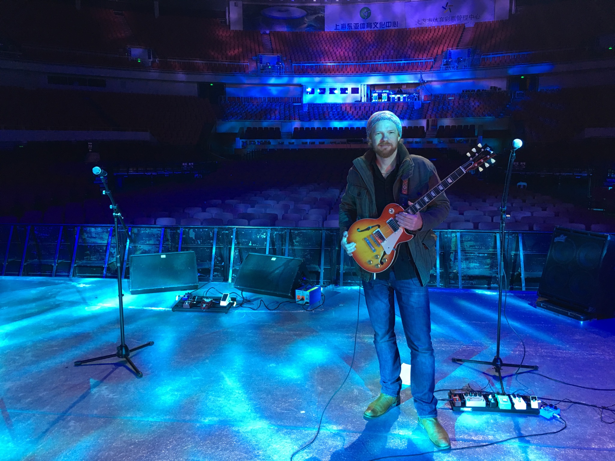 Ben on a blue-lit arena stage