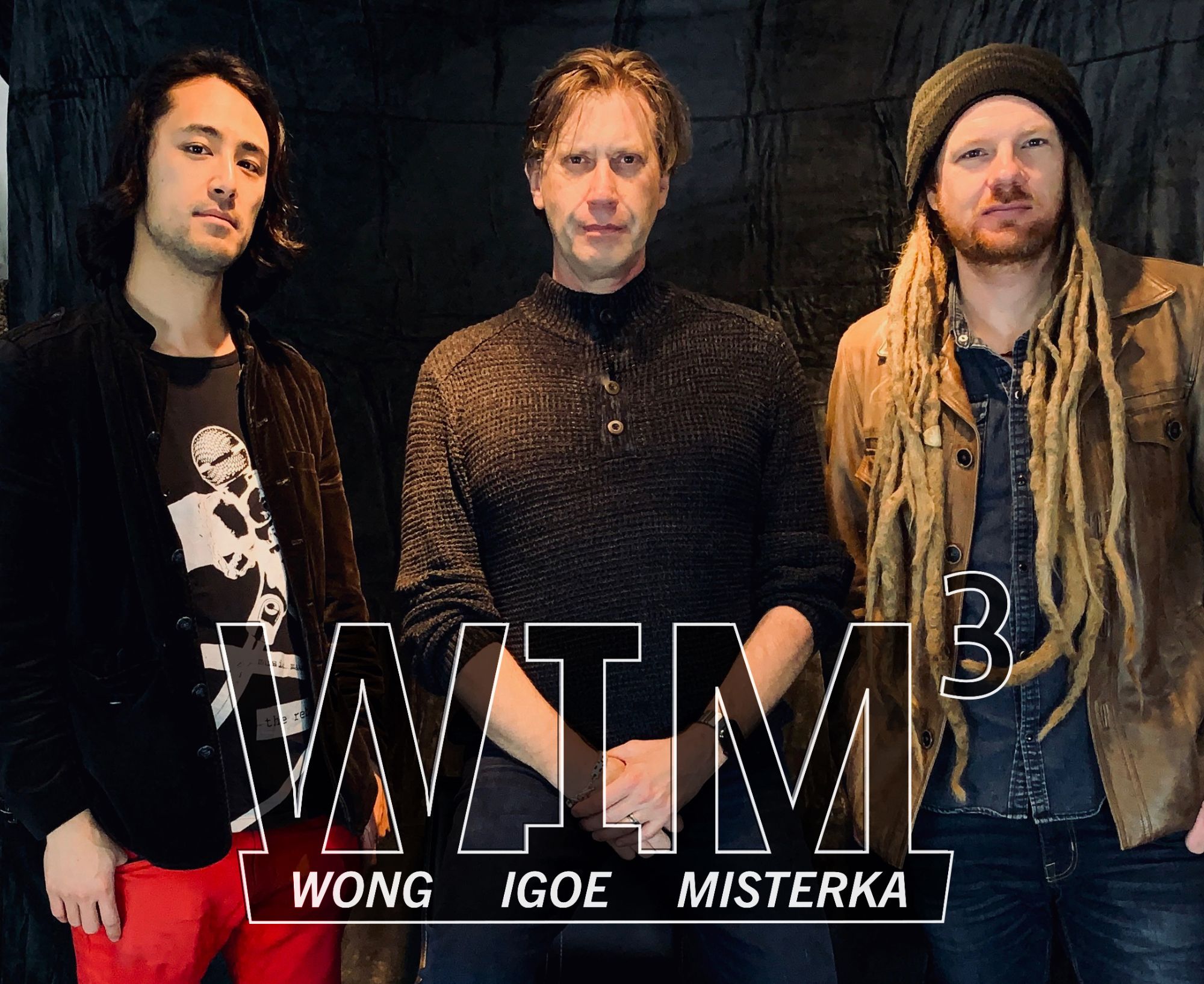 Kevin Wong, Tommy Igoe and Ben Misterka with the WIM³ logo